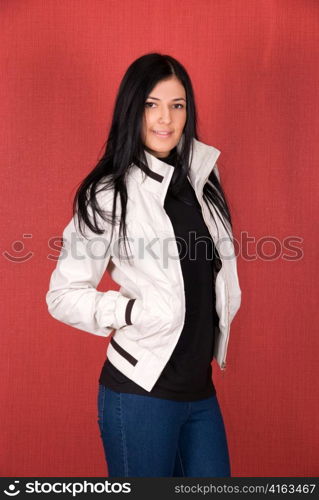 beautiful woman in a red jacket on a red background