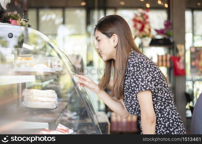 Beautiful woman in bakery shop