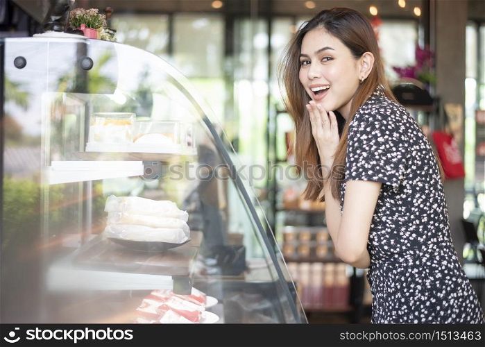 Beautiful woman in bakery shop
