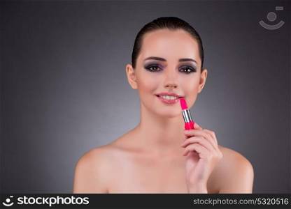 Beautiful woman in beauty concept with lipstick