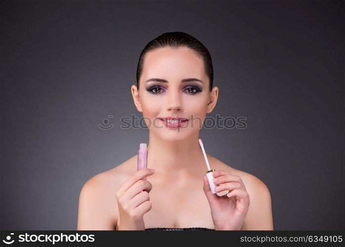 Beautiful woman in beauty concept with lipstick