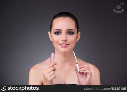 Beautiful woman in beauty concept with lipstick