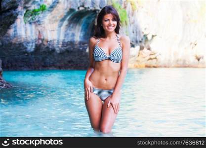 Beautiful woman in bikini on beach at Maya bay, Thailand. Woman in bikini on beach
