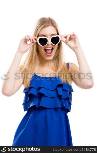 Beautiful woman in blue dress using sunglasses, isolated over white background