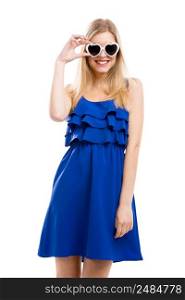 Beautiful woman in blue dress using sunglasses, isolated over white background