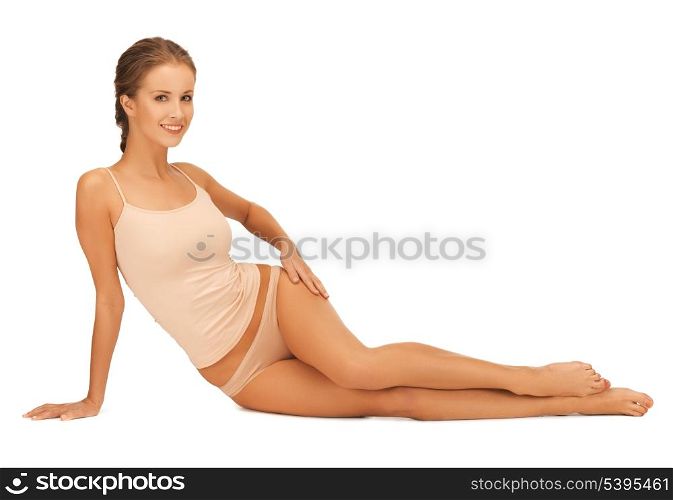 beautiful woman in cotton underwear touching her legs