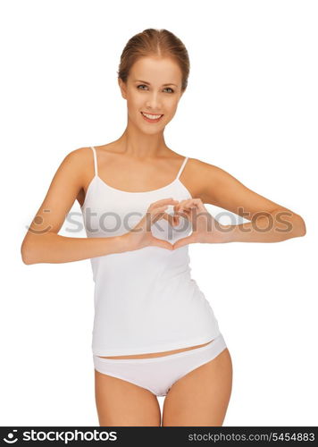 beautiful woman in cotton undrewear forming heart shape