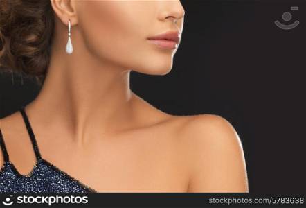 beautiful woman in evening dress wearing diamond earrings
