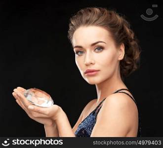 beautiful woman in evening dress with big diamond. woman with big diamond