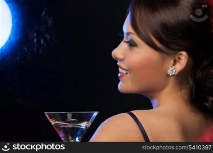beautiful woman in evening dress with cocktail having fun