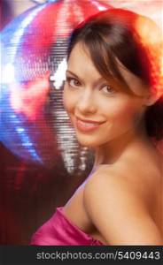 beautiful woman in evening dress with disco ball