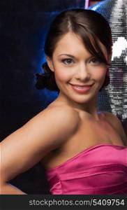 beautiful woman in evening dress with disco ball