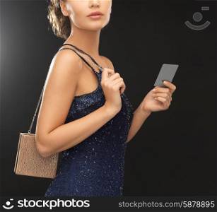 beautiful woman in evening dress with small bag
