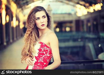 Beautiful woman in evening fashionable dress. Nightlife party concept.