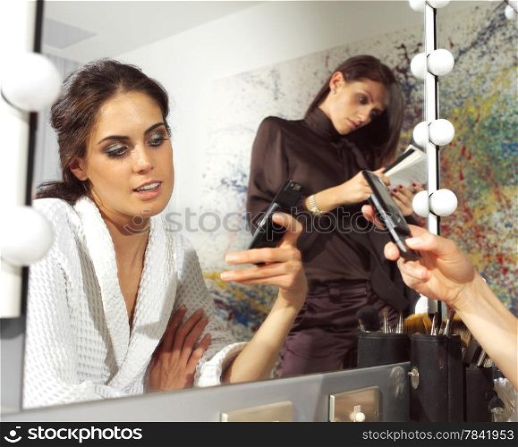 beautiful woman in front of mirror in dressing room