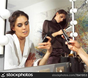 beautiful woman in front of mirror in dressing room