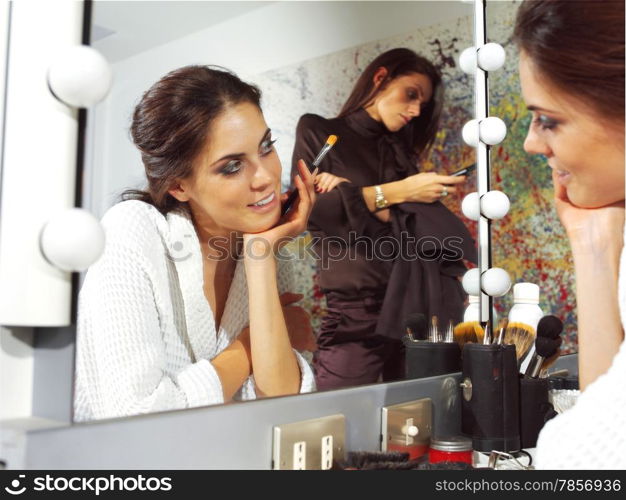 beautiful woman in front of mirror in dressing room