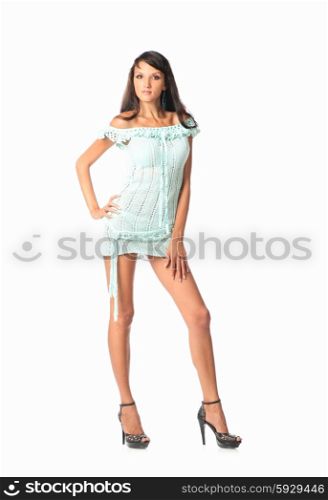 Beautiful woman in full length posing in short sexual party dress, over white background.
