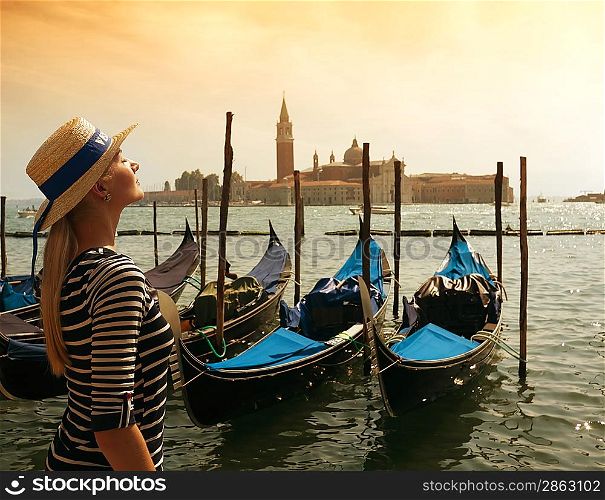 Beautiful woman in hat against Venice panorama