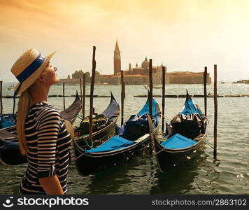 Beautiful woman in hat against Venice panorama