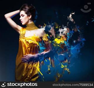 beautiful woman in long dress with jewelry and splatter