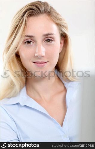 Beautiful woman in office working on laptop computer
