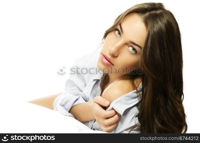 beautiful woman in pajamas showing her shoulder. beautiful woman in pajamas showing her shoulder on white background