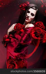 beautiful woman in red fabric with red roses