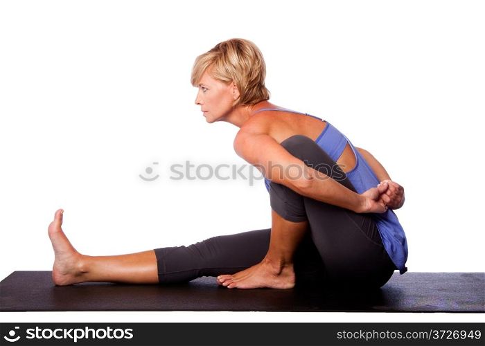 Beautiful woman in Seated Spinal Twist Marichyasana yoga pose stretching leg and spine exercise, isolated.