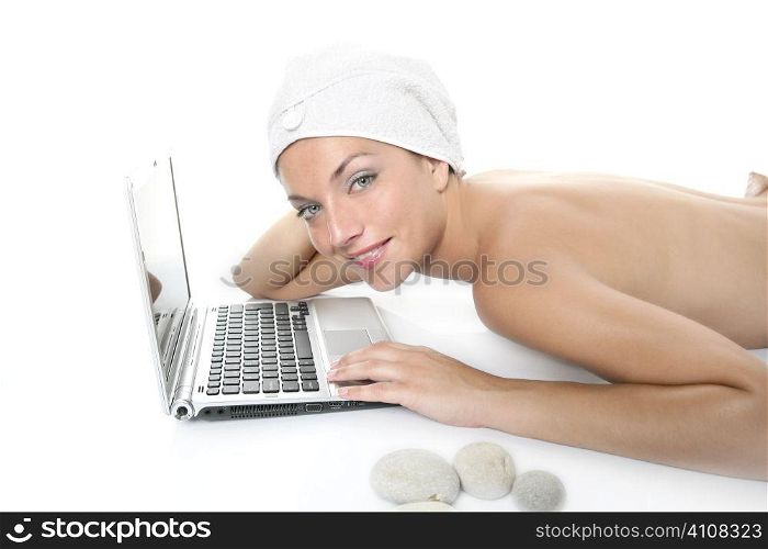 Beautiful woman in spa working with laptop computer