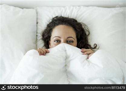 Beautiful woman in the bed and smiling by the morning