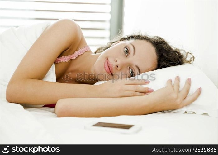 Beautiful woman in the bed with lazy to get up