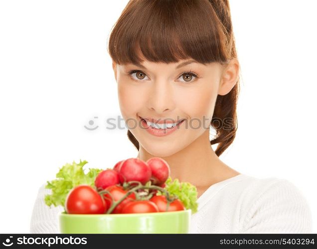 beautiful woman in the kitchen with tomatoes..