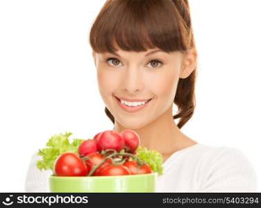 beautiful woman in the kitchen with tomatoes..