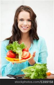 beautiful woman in the kitchen with vegetables