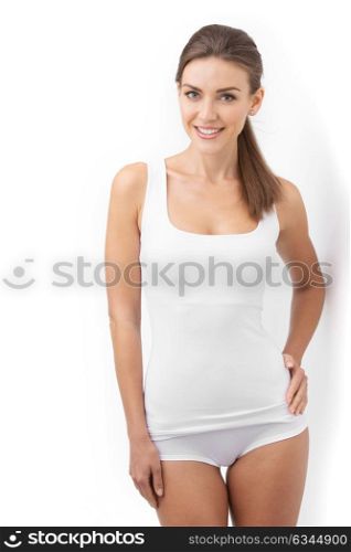 Beautiful woman in underwear. Young beautiful woman in cotton underwear posing on white background