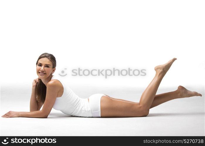Beautiful woman in underwear. Young beautiful woman in cotton underwear sitting on white background