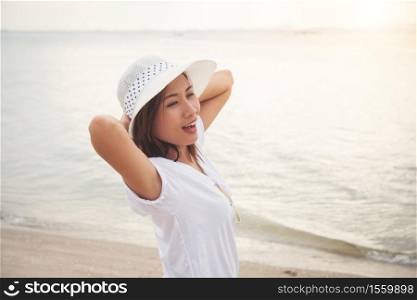 Beautiful woman in vacation at sea, Standing on the beach. Freedom enjoy. Women lifestyle concept.