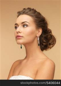 beautiful woman in white dress and diamond earrings