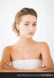 beautiful woman in white dress with diamond necklace