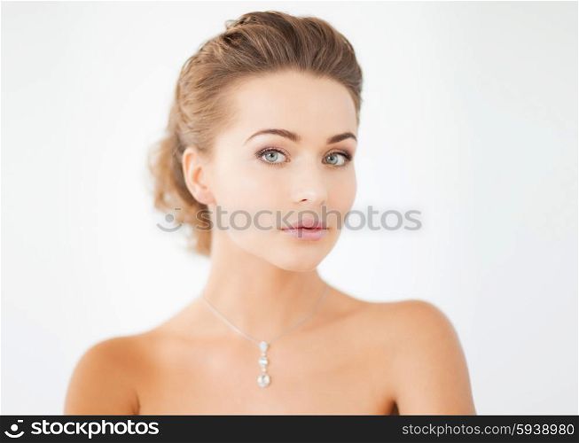 beautiful woman in white dress with diamond necklace. woman with diamond necklace