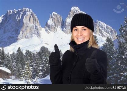 Beautiful woman in winter holidays in the mountains