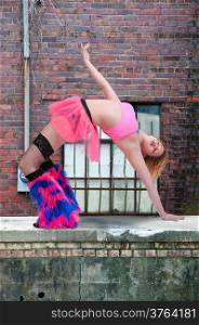 Beautiful woman involved in acrobatic exercise activity