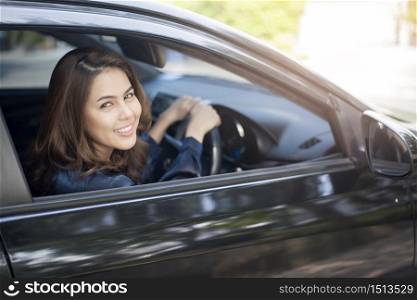 Beautiful woman is driving her car
