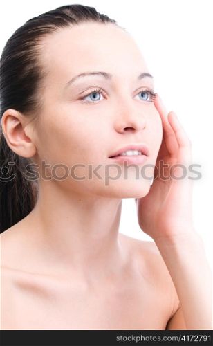 beautiful woman is looking sideways and touching her face, isolated on white
