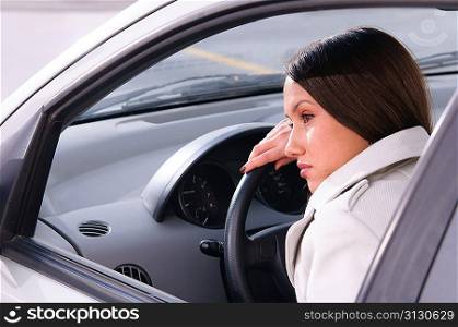 beautiful woman is resting in a car
