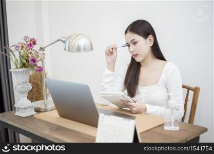 Beautiful woman is working from home