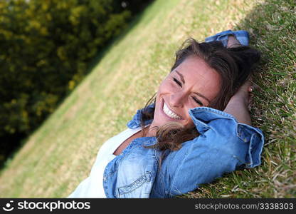 Beautiful woman laying down in the grass