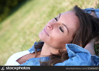 Beautiful woman laying down in the grass