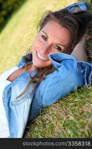 Beautiful woman laying down in the grass